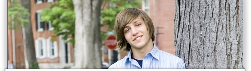 Young man smiling outside